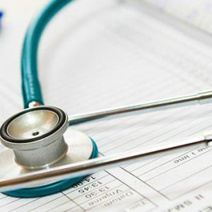 stethoscope laying on forms